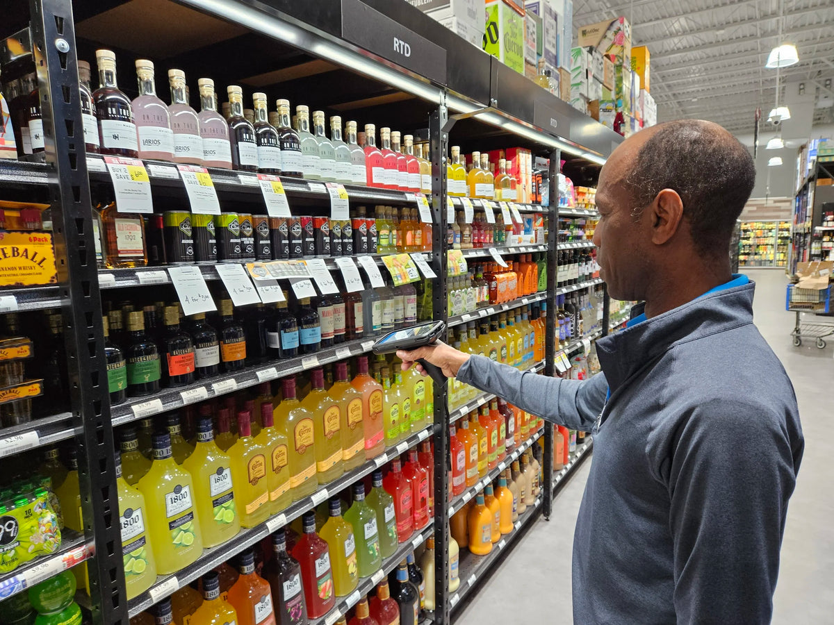 Retail employee scanning products during an inventory workflow